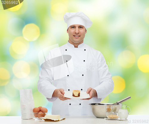 Image of happy male chef cook baking