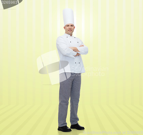 Image of happy male chef cook with crossed hands