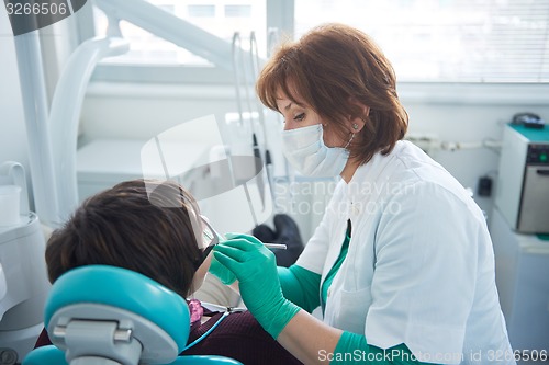 Image of woman patient at the dentist