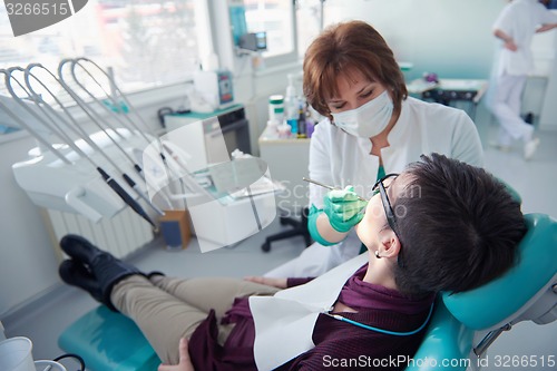 Image of woman patient at the dentist