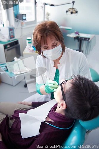 Image of woman patient at the dentist