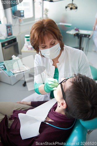 Image of woman patient at the dentist