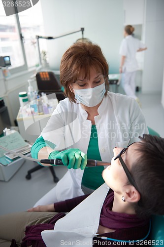 Image of woman patient at the dentist