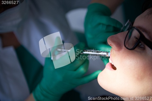 Image of woman patient at the dentist