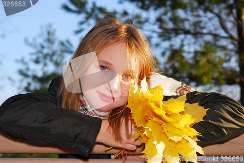 Image of Girl with autumn leaves