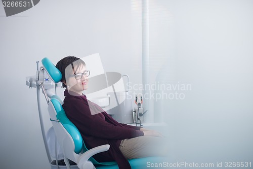 Image of woman patient at the dentist