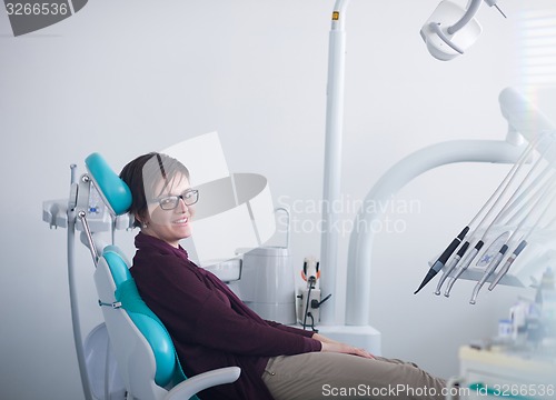 Image of woman patient at the dentist