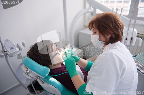 Image of woman patient at the dentist