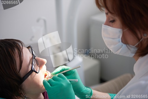 Image of woman patient at the dentist