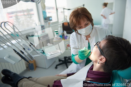 Image of woman patient at the dentist