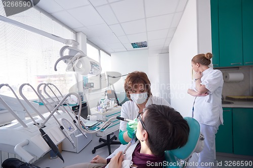 Image of woman patient at the dentist