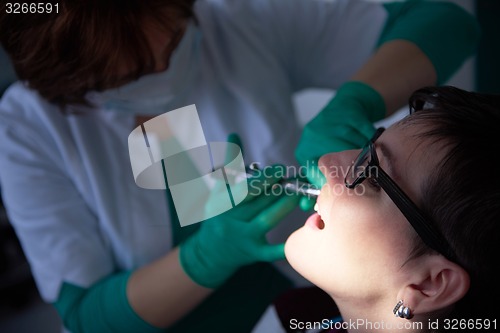 Image of woman patient at the dentist