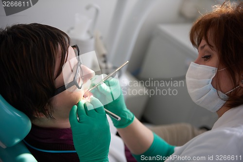 Image of woman patient at the dentist