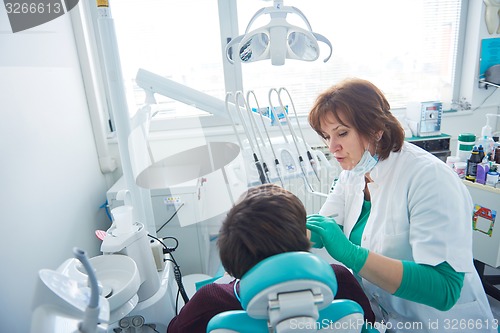 Image of woman patient at the dentist