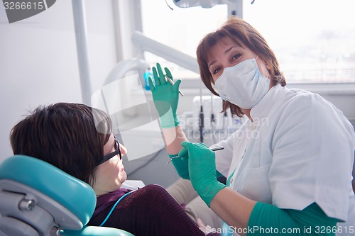 Image of woman patient at the dentist