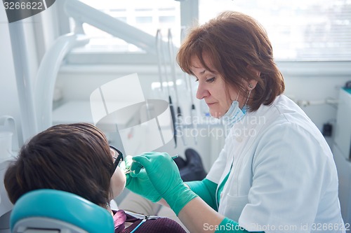 Image of woman patient at the dentist