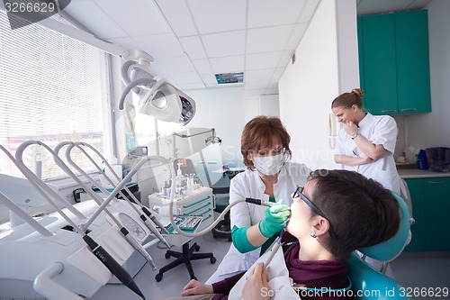 Image of woman patient at the dentist