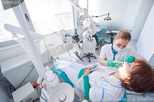 Image of woman patient at the dentist