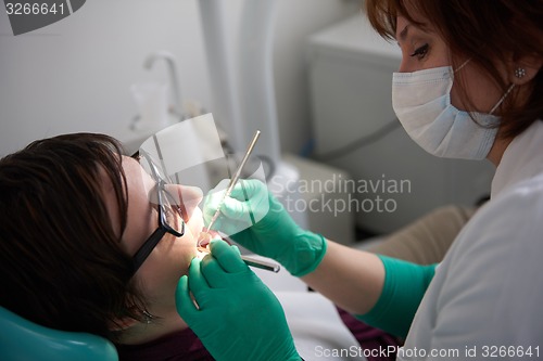 Image of woman patient at the dentist