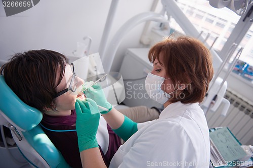 Image of woman patient at the dentist