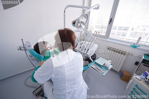 Image of woman patient at the dentist