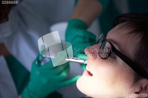 Image of woman patient at the dentist