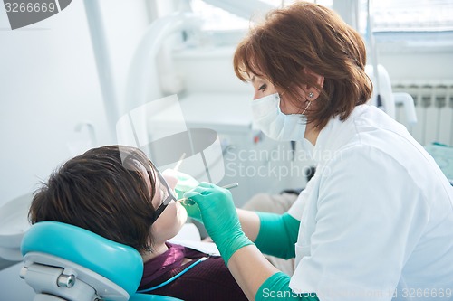 Image of woman patient at the dentist