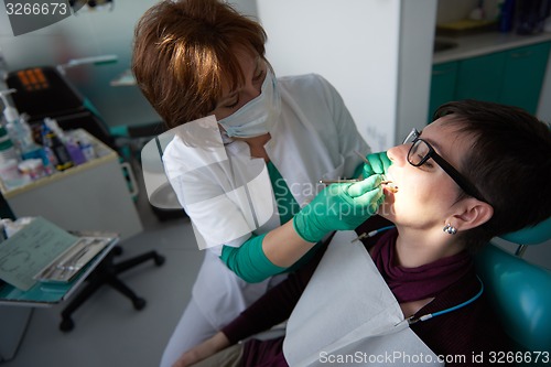 Image of woman patient at the dentist