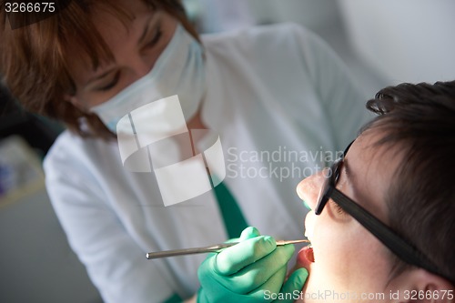 Image of woman patient at the dentist