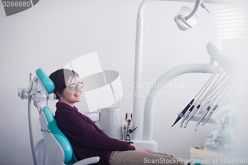 Image of woman patient at the dentist