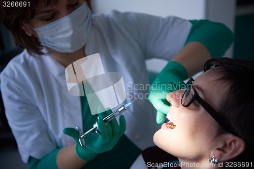 Image of woman patient at the dentist