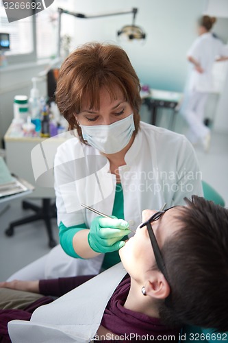 Image of woman patient at the dentist