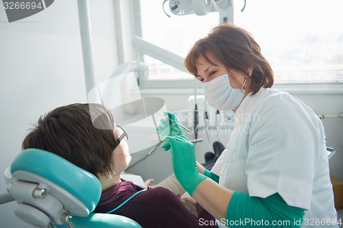 Image of woman patient at the dentist