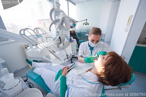 Image of woman patient at the dentist