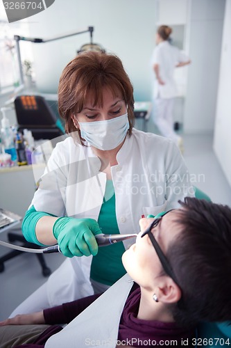 Image of woman patient at the dentist