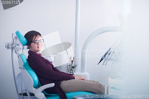 Image of woman patient at the dentist