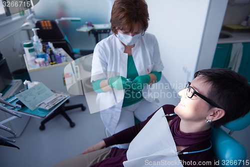 Image of woman patient at the dentist