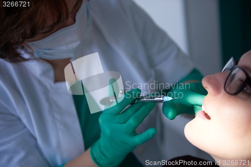 Image of woman patient at the dentist