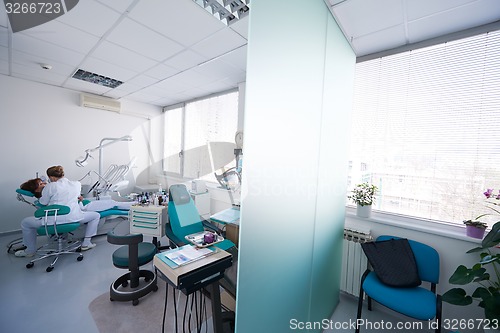 Image of woman patient at the dentist