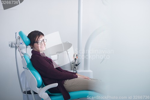 Image of woman patient at the dentist