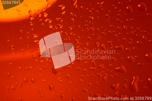 Image of red abstract background with water drops