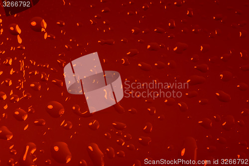Image of red abstract background with water drops