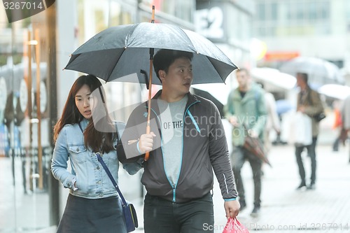 Image of People walking on street