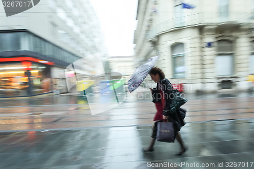 Image of Motion of woman in a rain 