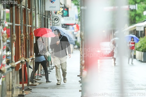 Image of People on rainy day