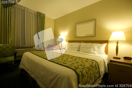 Image of hotel room with queen size bed