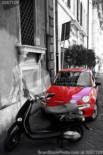 Image of Red tiny car at the city street, Rome, Italia
