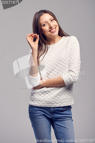 Image of Happy smiling woman with ok hand sign