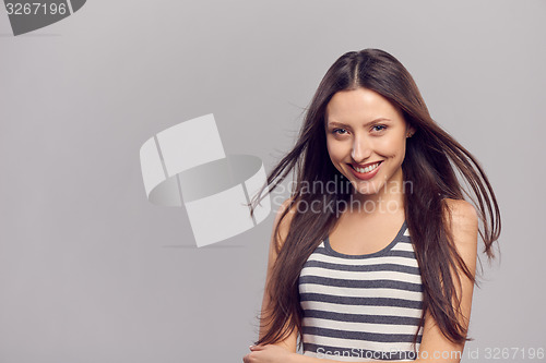 Image of Happy woman with flying hair