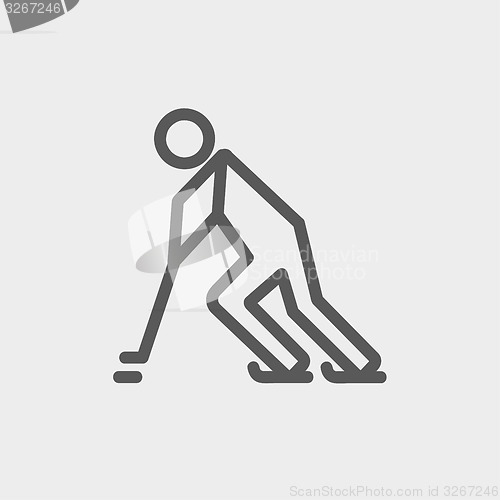 Image of Hockey player pushing the puck thin line icon